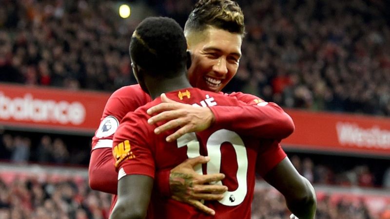 Liverpool forwards Roberto Firmino (9) and Sadio Mane (10)