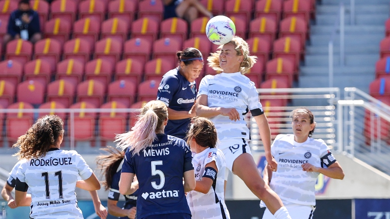 Portland Thorns FC midfielder Lindsey Horan (10) and Carolina Courage forward Lynn Williams (9)