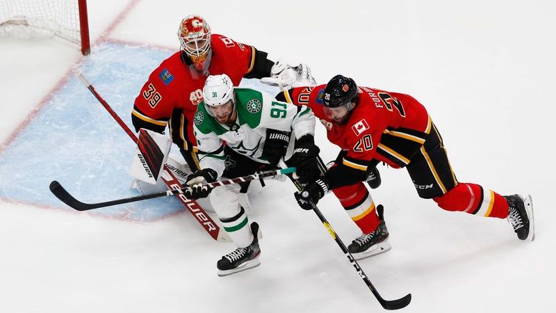 Dallas Stars center Tyler Seguin, Calgary Flames goaltender Cam Talbot, Calgary Flames defenseman Derek Forbort