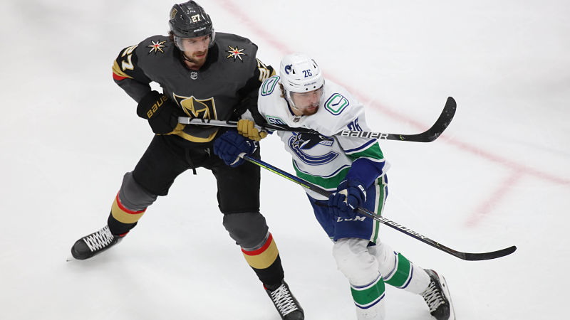 egas Golden Knights defenseman Shea Theodore and Vancouver Canucks left wing Antoine Roussel