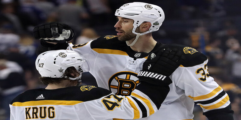 Boston Bruins' Torey Krug And Zdeno Chara