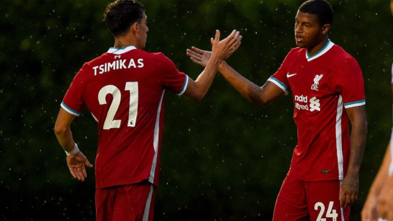 Liverpool defender Konstantinos Tsimikas (left) and striker Rhian Brewster