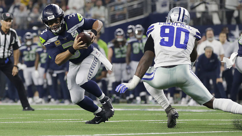 Seattle Seahawks quarterback Russell Wilson and Dallas Cowboys defensive lineman DeMarcus Lawrence