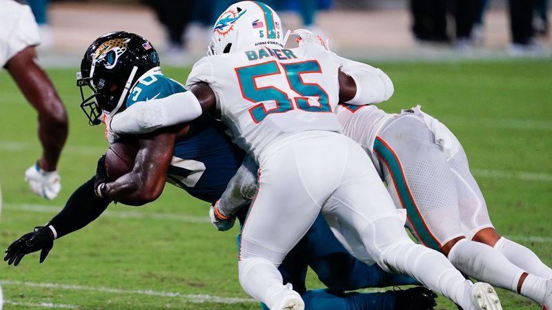 Jacksonville Jaguars running back James Robinson, Miami Dolphins linebacker Jerome Baker