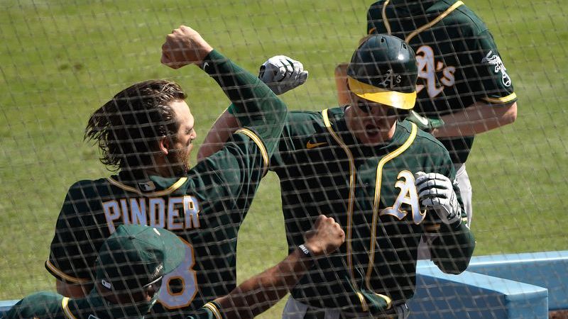 Oakland Athletics third basemen Chad Pinder, Oakland Athletics left fielder Mark Canha