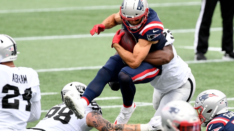 New England Patriots wide receiver Julian Edelman (11) and Las Vegas Raiders defensive end Maxx Crosby (98)