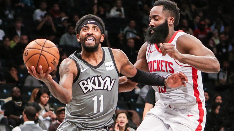 Brooklyn Nets guard Kyrie Irving (11) and Houston Rockets guard James Harden (13)