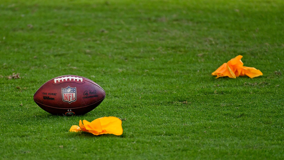 A football and penalty flags