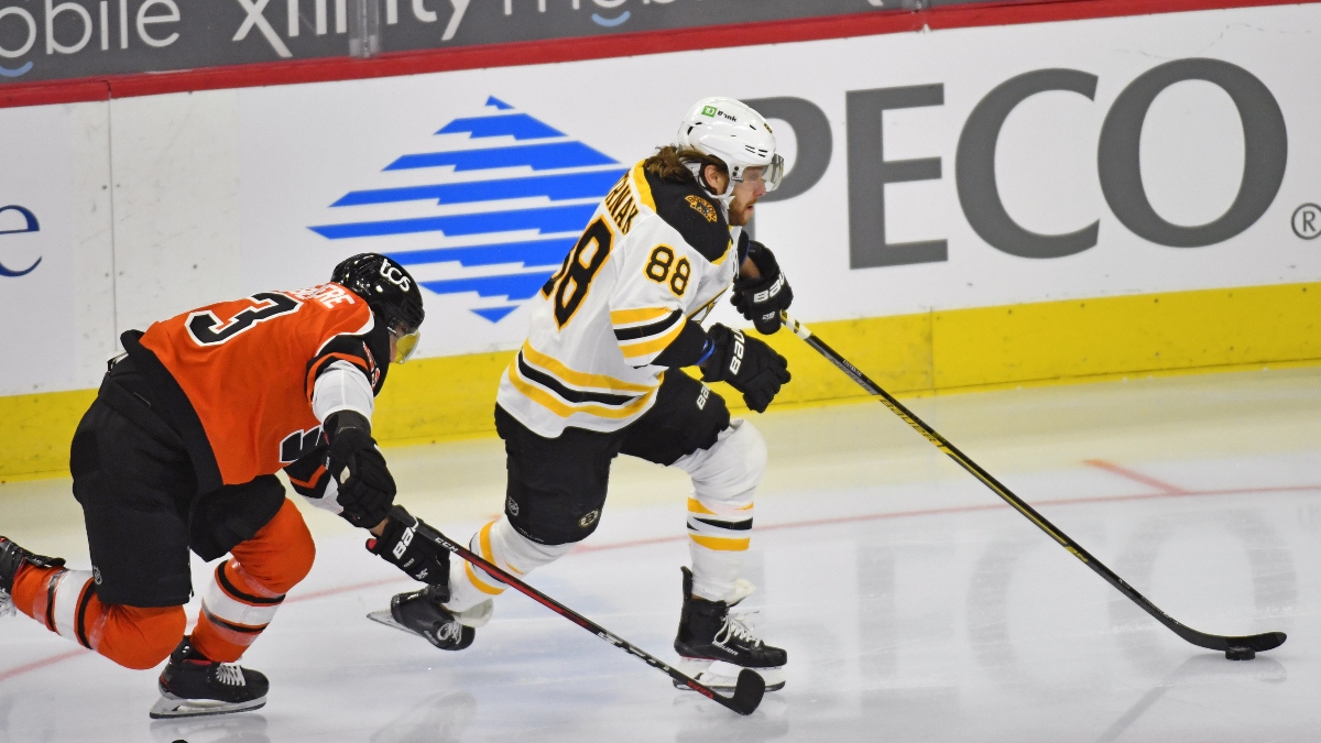 Boston Bruins right wing David Pastrnak (88) and Philadelphia Flyers defenseman Shayne Gostisbehere (53)