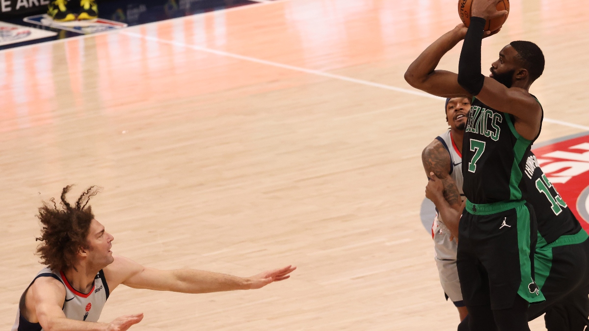 Boston Celtics guard Jaylen Brown (7) and Washington Wizards center Robin Lopez (15)