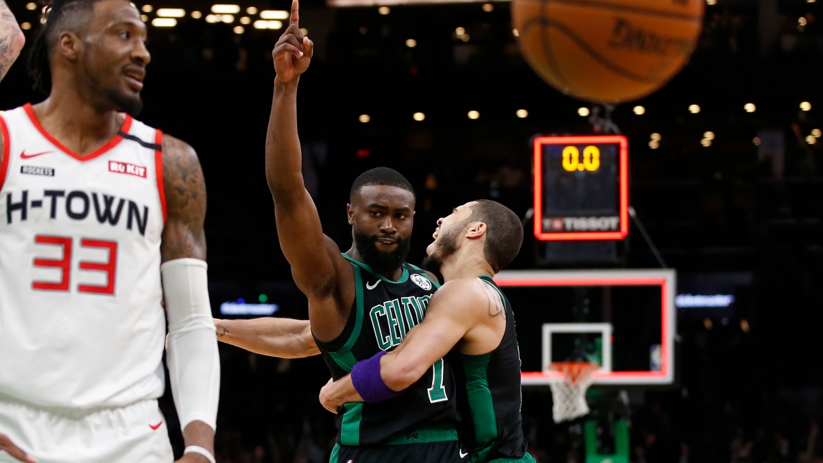 Boston Celtics forwards Jaylen Brown (7) reacts with forward Jayson Tatum (0)