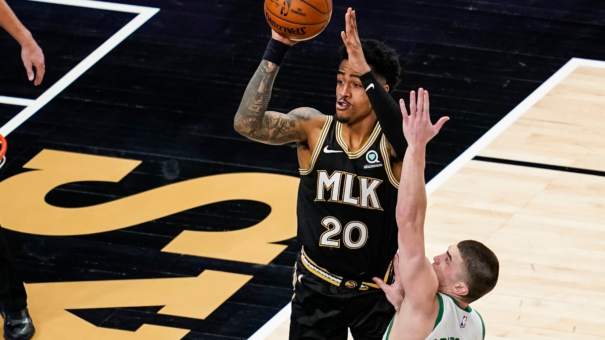 Atlanta Hawks forward John Collins (20) and Boston Celtics guard Payton Pritchard (11)