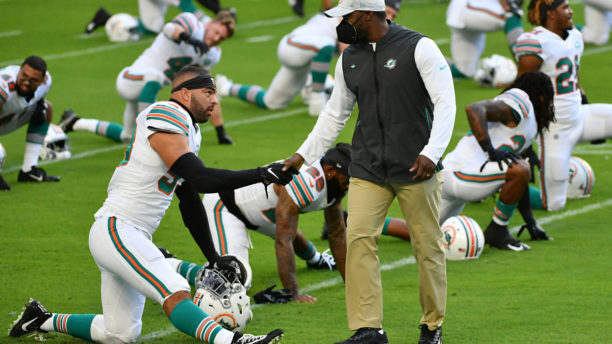New England Patriots linebacker Kyle Van Noy and Miami Dolphins head coach Brian Flores