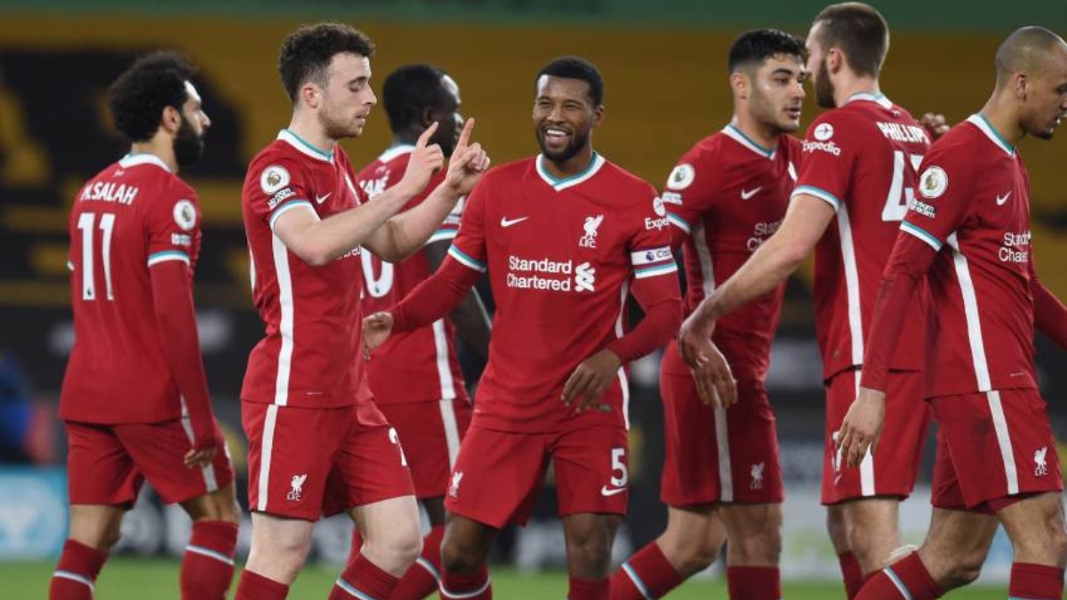 Liverpool forward Diogo Jota (20), midfielder Georginio Wijnaldum (5) and teammates