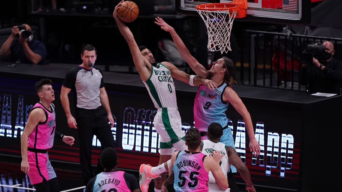 Boston Celtics forward Jayson Tatum (0) and Miami Heat forward Kelly Olynyk (9)