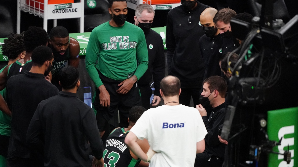 Celtics coach Brad Stevens, assistant coach Jerome Allen and players