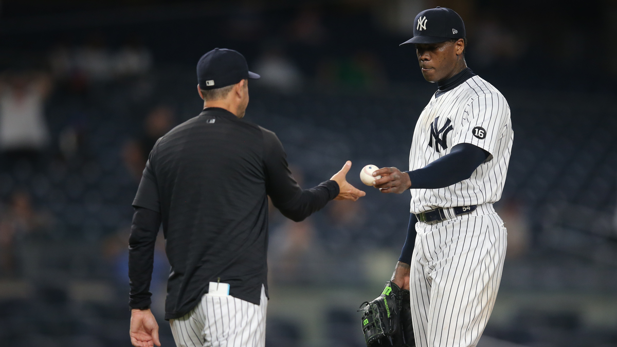 New York Yankees closer Aroldis Chapman, manager Aaron Boone