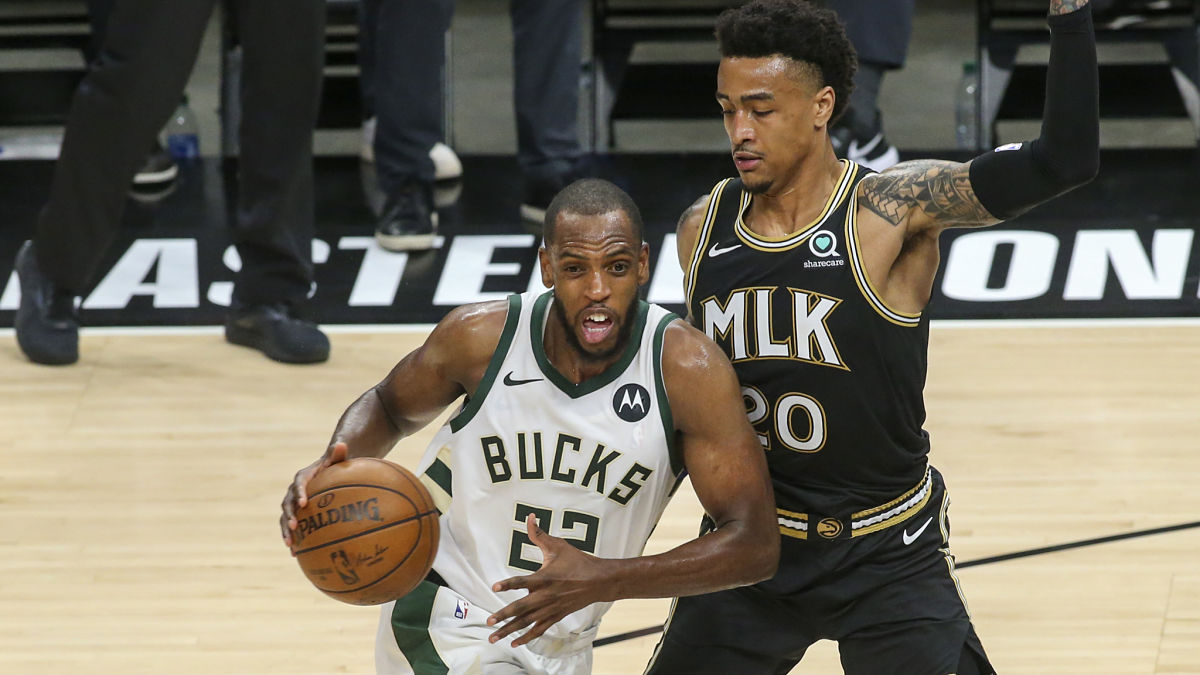Milwaukee Bucks forward Khris Middleton and Atlanta Hawks forward John Collins