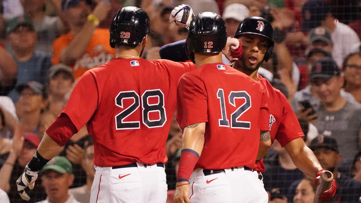 Boston Red Sox left fielder J.D. Martinez, Marwin Gonzalez, Xander Bogaerts