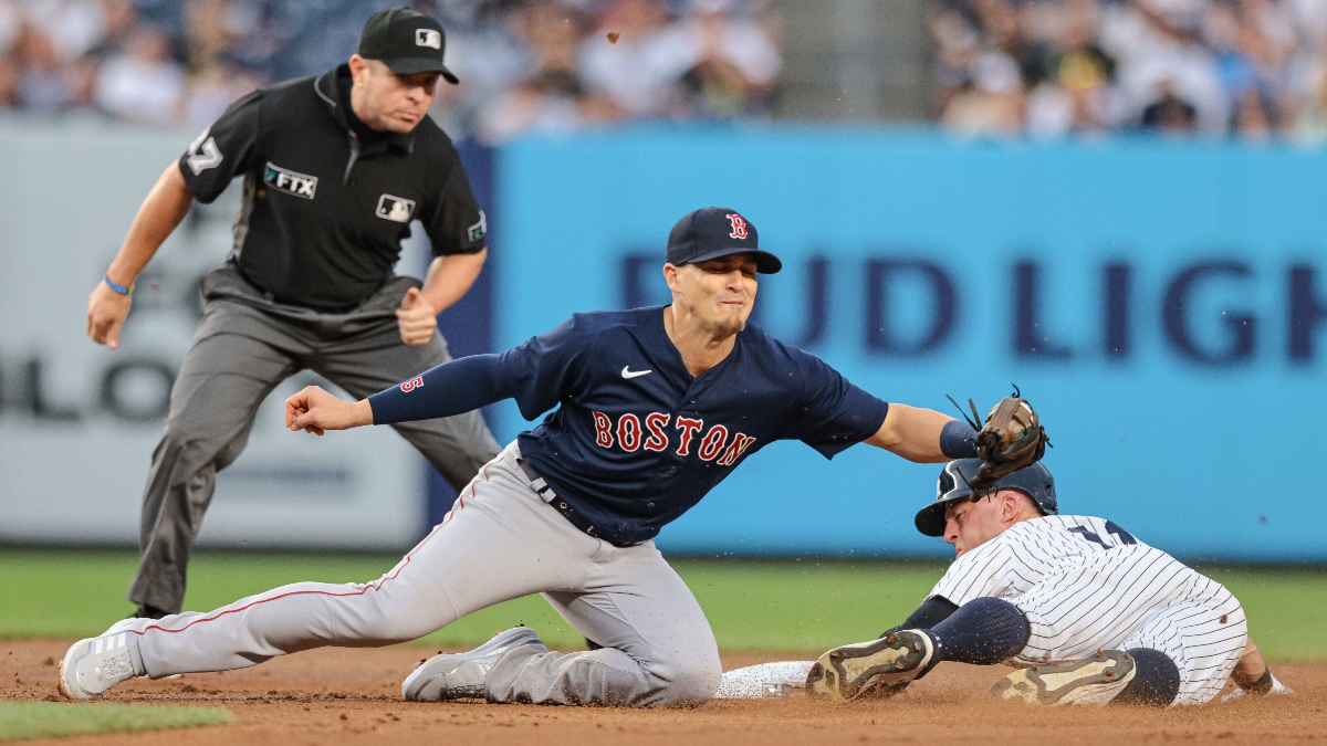 Boston Red Sox second baseman Kiké Hernández (left) and New York Yankees left fielder Brett Gardner
