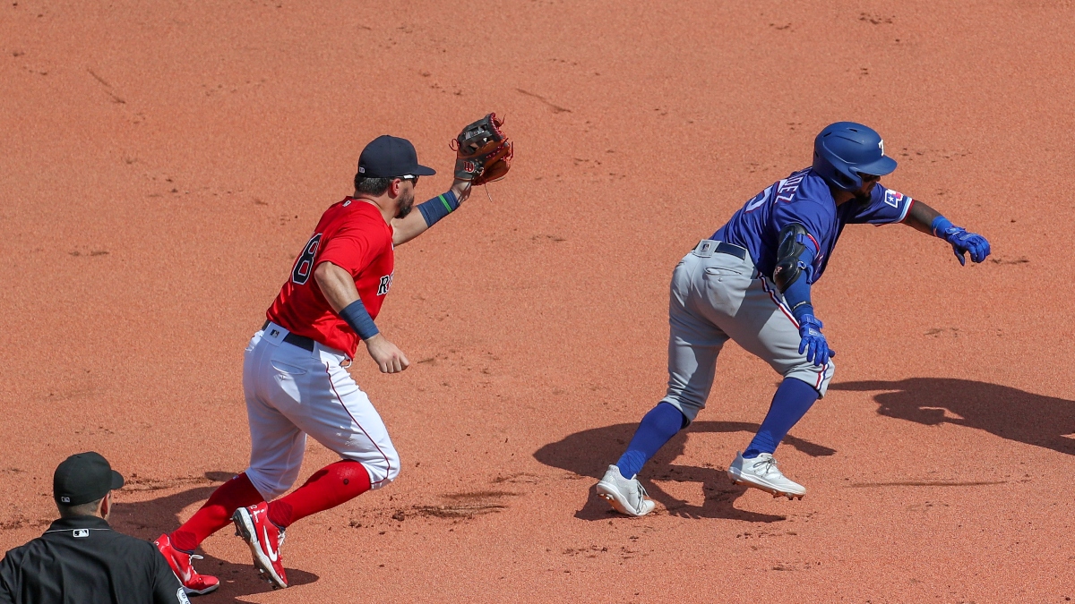 Boston Red Sox slugger Kyle Schwarber (left) and Texas Rangers infielder Yonny Hernandez