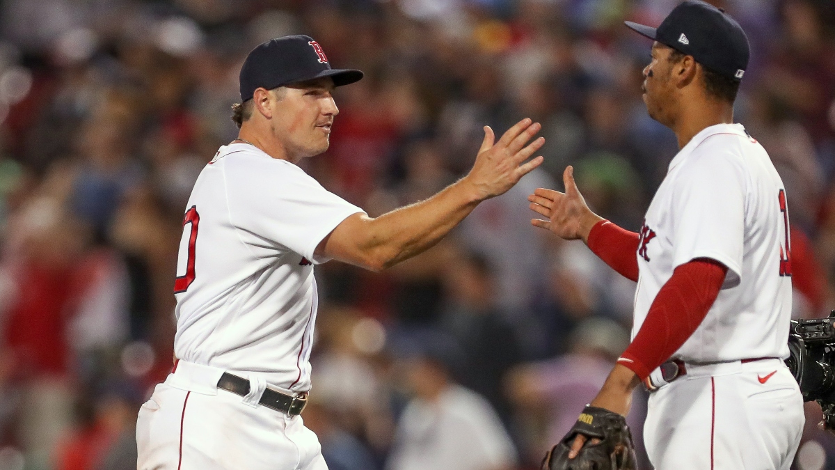 Boston Red Sox right fielder Hunter Renfroe (10) and third baseman Rafael Devers (11)