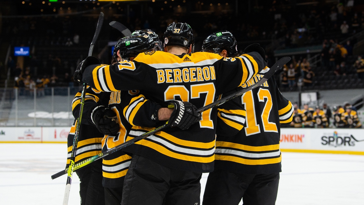 Boston Bruins center Patrice Bergeron (37) and teammates