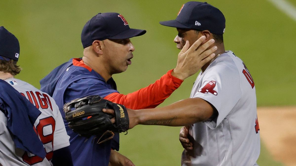 Boston Red Sox manager Alex Cora, third baseman Rafael Devers