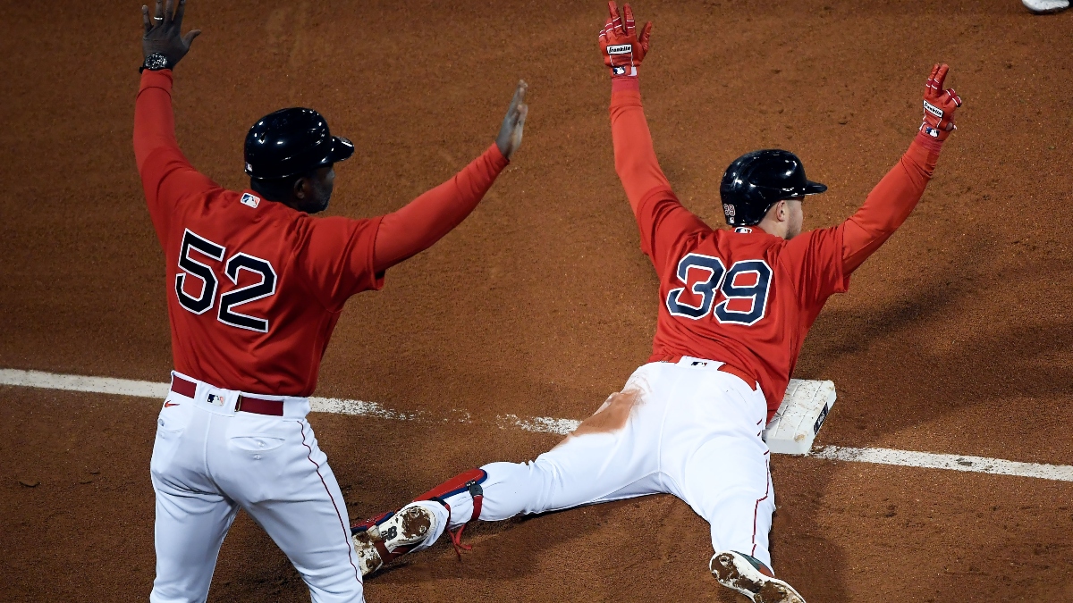 Boston Red Sox second baseman Christian Arroyo (39) and third base coach Carlos Febles (52)