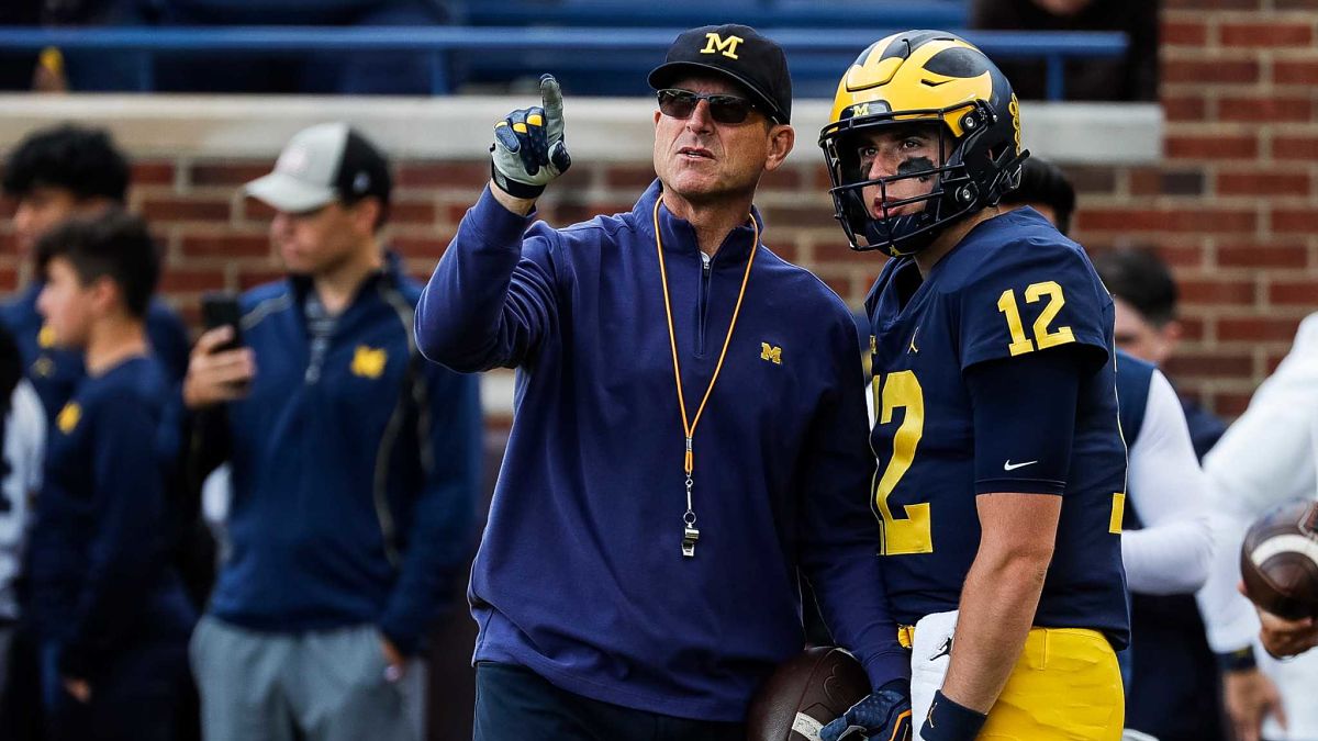 Michigan head coach Jim Harbaugh and quarterback Cade McNamara