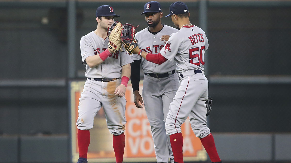 Former Boston Red Sox outfielders Andrew Benintendi, Jackie Bradley Jr., Mookie Betts