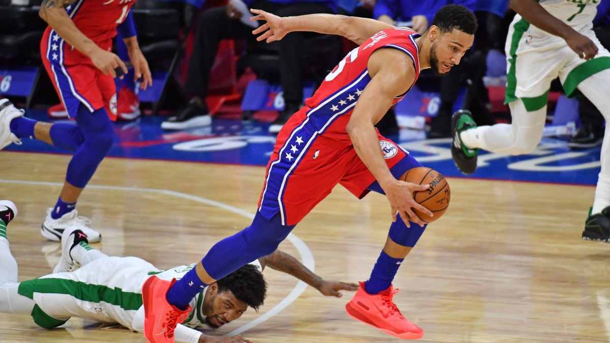 Philadelphia 76ers guard Ben Simmons (25) and Boston Celtics guard Marcus Smart (36)