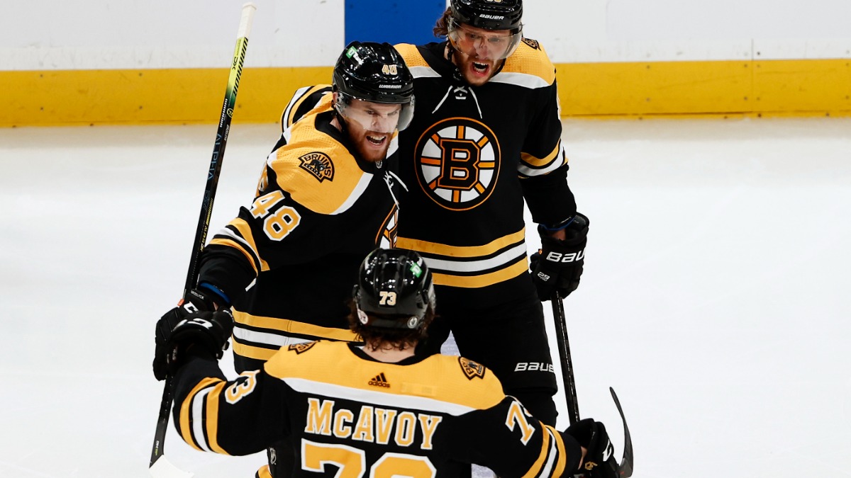 Boston Bruins defensemen Charlie McAvoy and Matt Grzelcyk