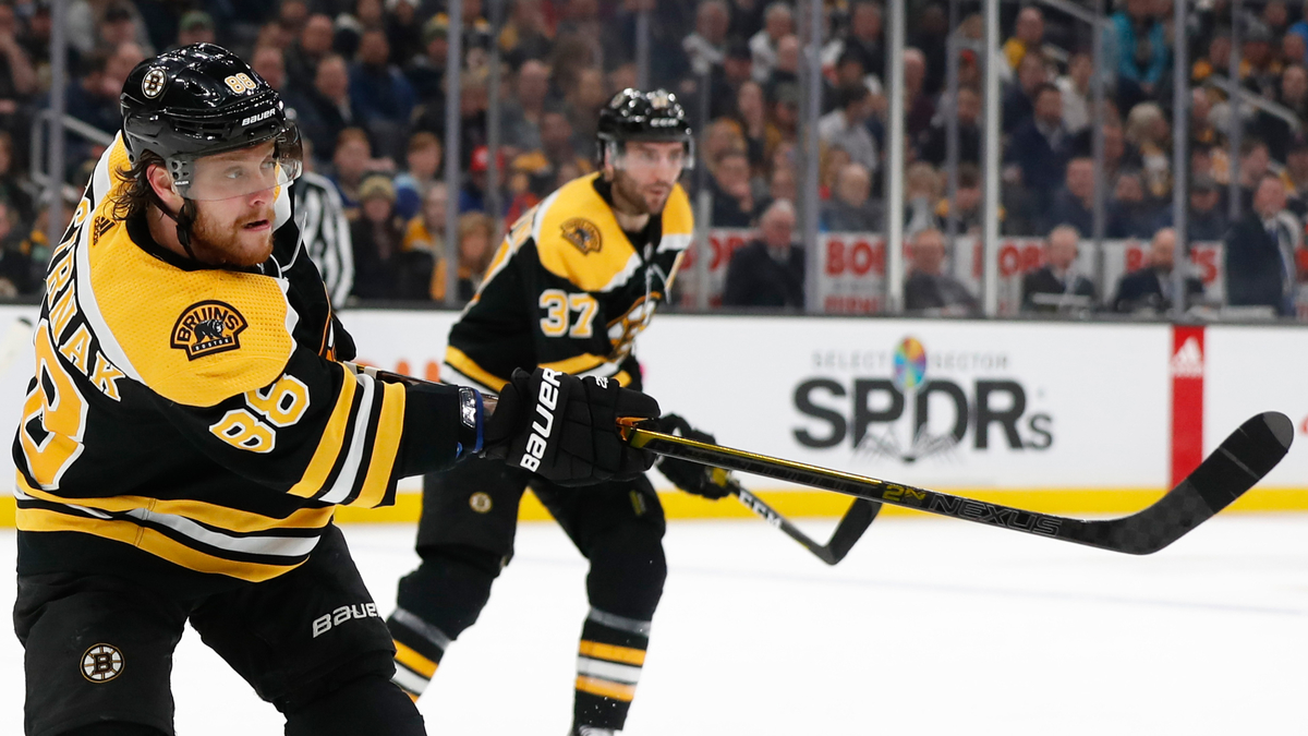 Boston Bruins forwards David Pastrnak and Patrice Bergeron