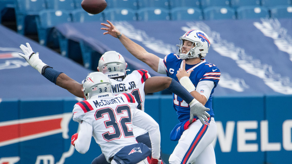 New England Patriots safety Devin McCourty, defensive lineman Deatrich Wise and Buffalo Bills quarterback Josh Allen