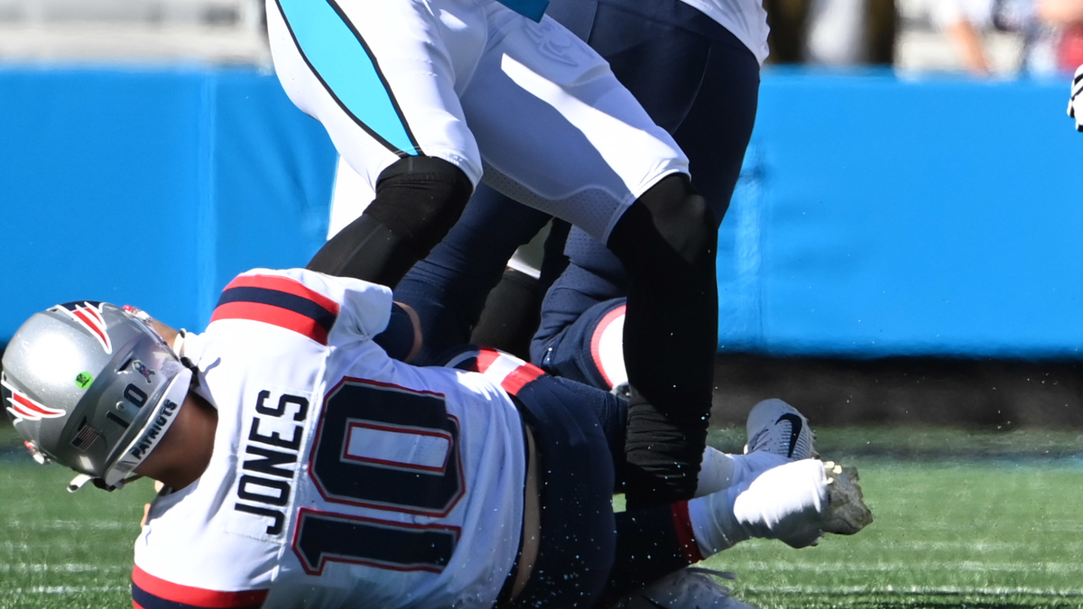New England Patriots quarterback Mac Jones, Carolina Panthers defensive end Brian Burns