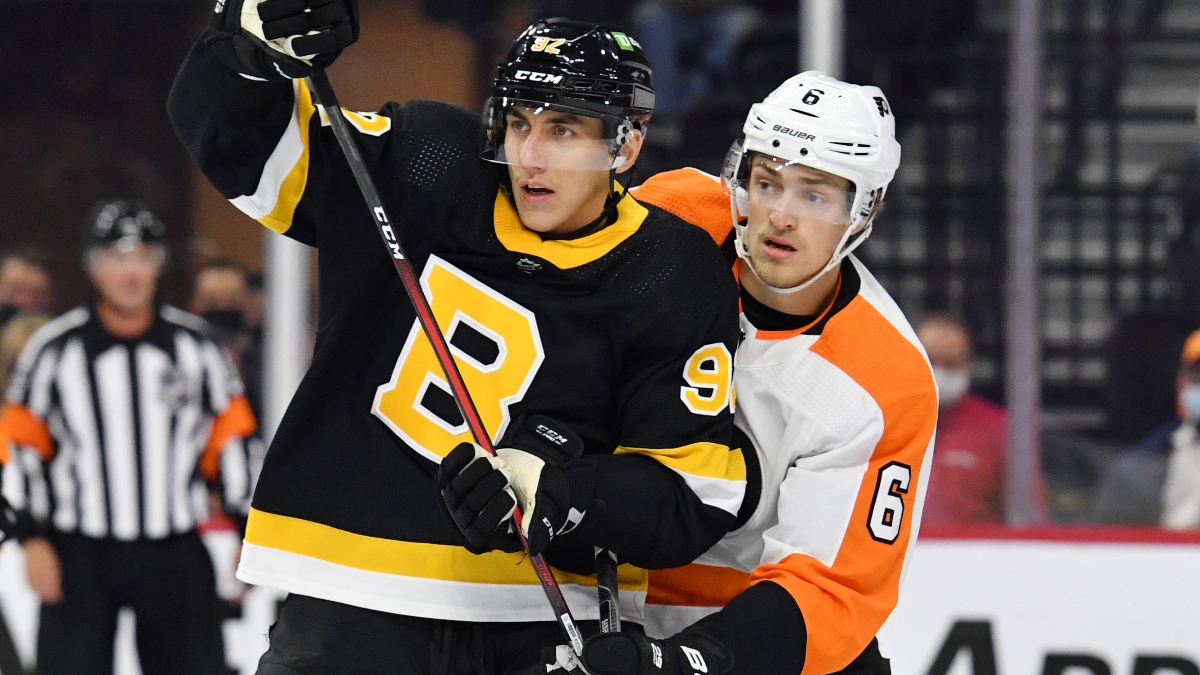 Boston Bruins left wing Tomas Nosek (92) and Philadelphia Flyers defenseman Travis Sanheim (6)