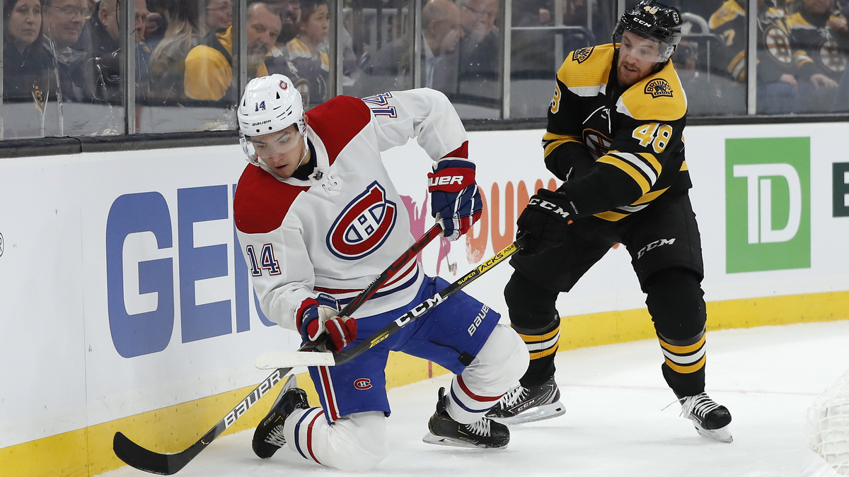 Montreal Canadiens center Nick Suzuki, Boston Bruins defenseman Matt Grzelcyk