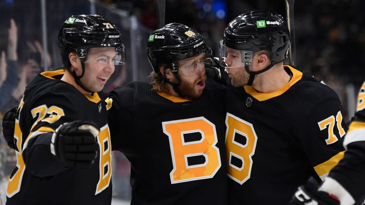 Boston Bruins' Charlie McAvoy, David Pastrnak, Taylor Hall
