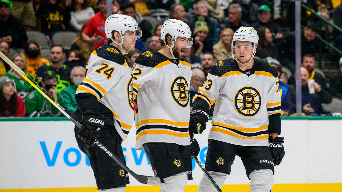 Boston Bruins left wing Jake DeBrusk, center Craig Smith and defenseman Charlie McAvoy
