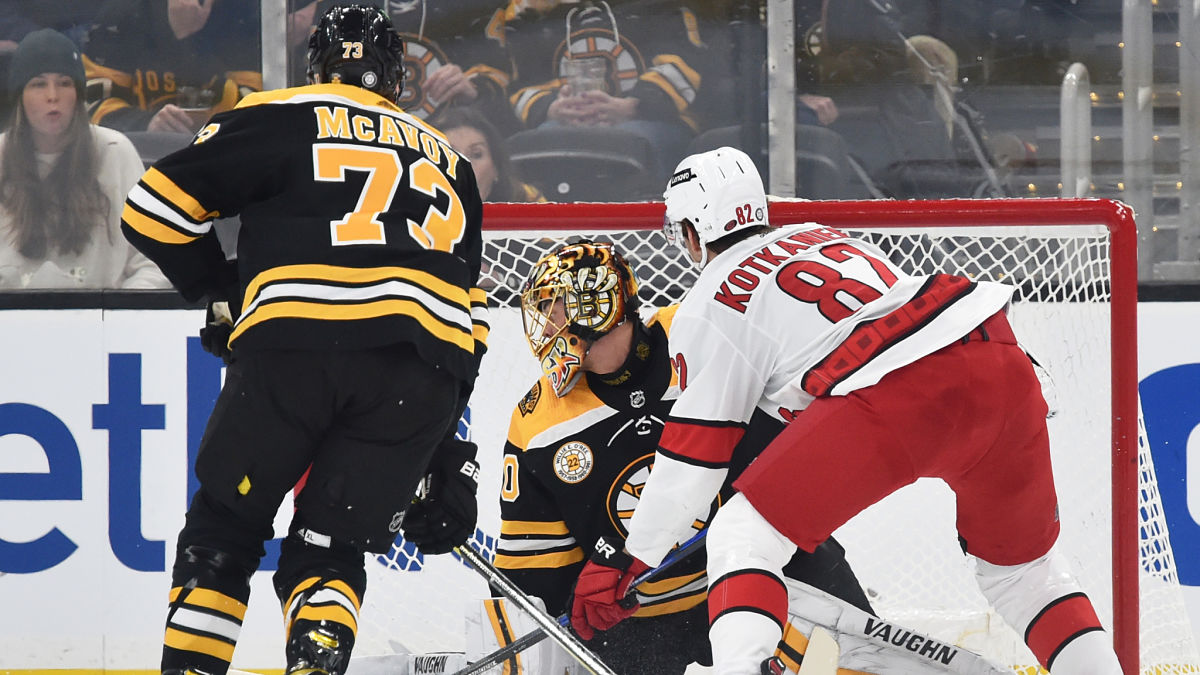 Boston Bruins defenseman Charlie McAvoy, Carolina Hurricanes center Jesperi Kotkaniemi