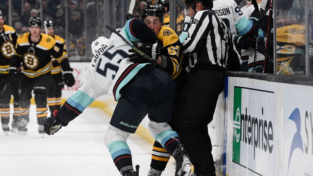 Boston Bruins winger Brady Marchand, Seattle Kraken defenseman Jeremy Lauzon