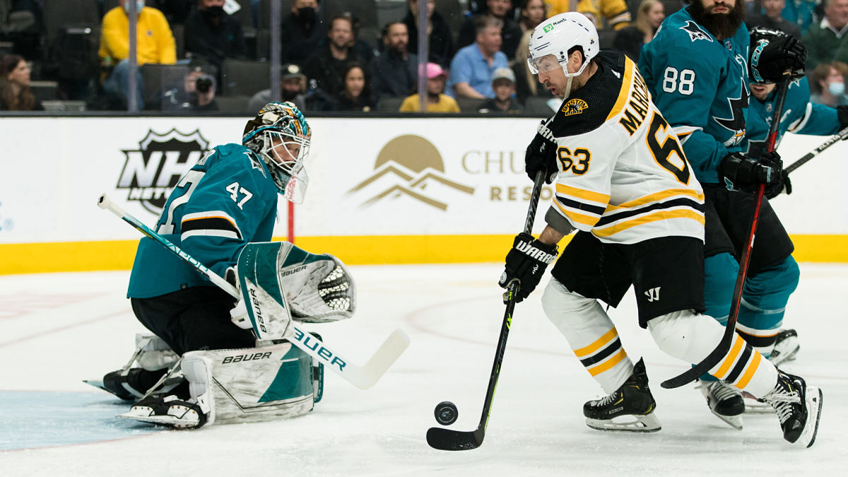 San Jose Sharks goaltender James Reimer, Boston Bruins left wing Brad Marchand