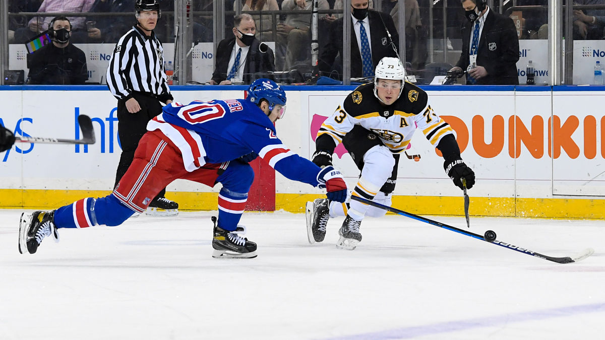 Boston Bruins defenseman Charlie McAvoy, New York Rangers left wing Chris Kreider