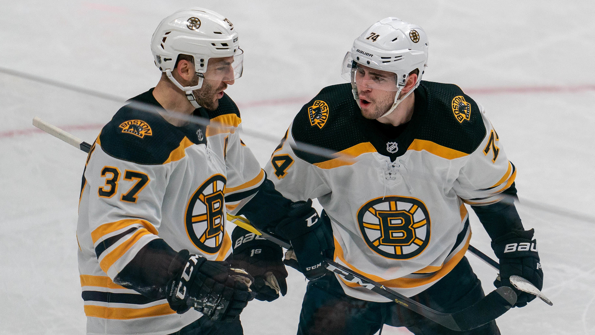 Boston Bruins forwards Patrice Bergeron, Jake DeBrusk