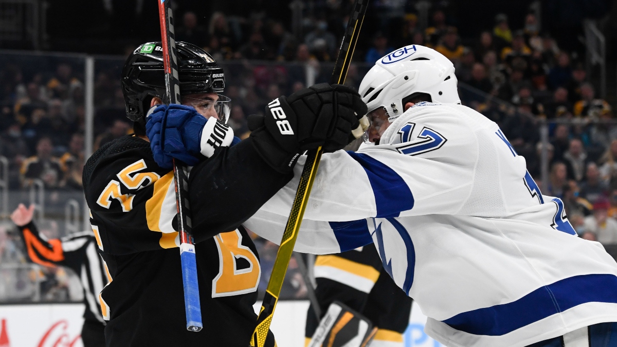 Boston Bruins defenseman Connor Clifton (75) and Tampa Bay Lightning left wing Alex Killorn (17)