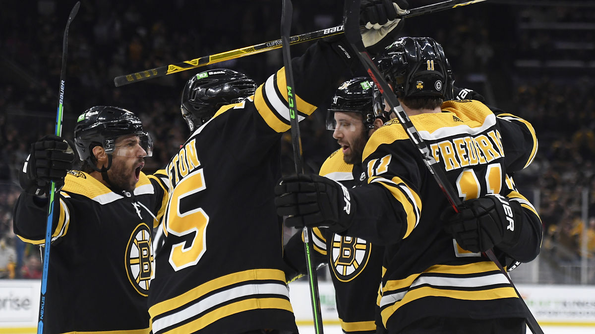 Boston Bruins center Craig Smith, defenseman Connor Clifton, center Trent Frederic