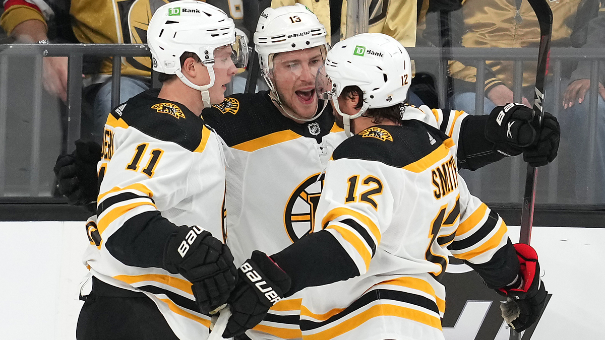 Boston Bruins forwards Trent Frederic, Charlie Coyle, Craig Smith
