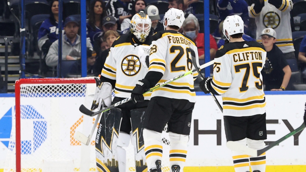 Boston Bruins goaltender Linus Ullmark (35), defensemen Derek Forbort (28) and Conor Clifton (75)