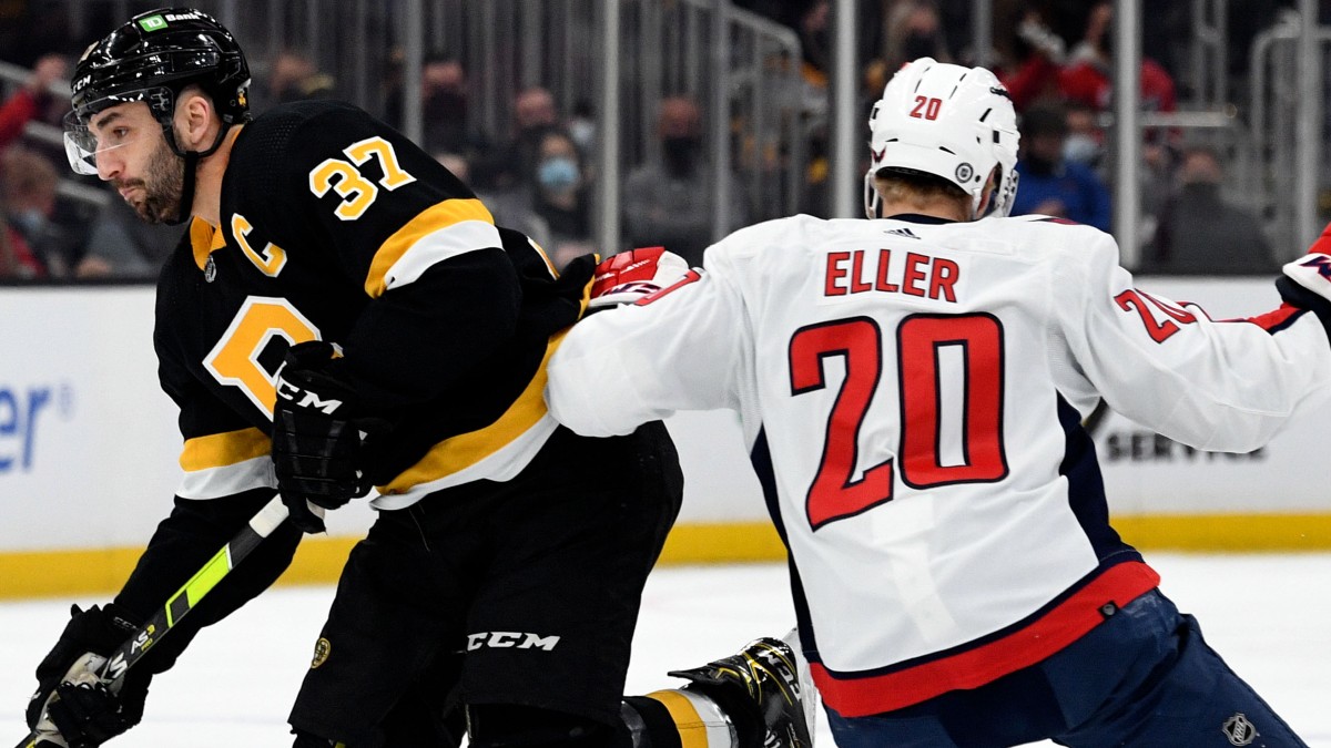 Boston Bruins center Patrice Bergeron and Washington Capitals left wing Lars Eller